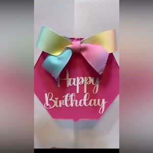 Cake Topper white Happy Birthday with multicolor bow and pink background new